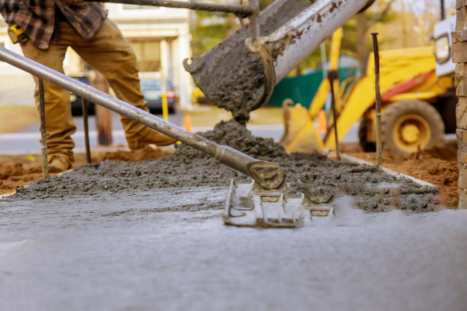 Worker working for concrete pavement for ground at construction